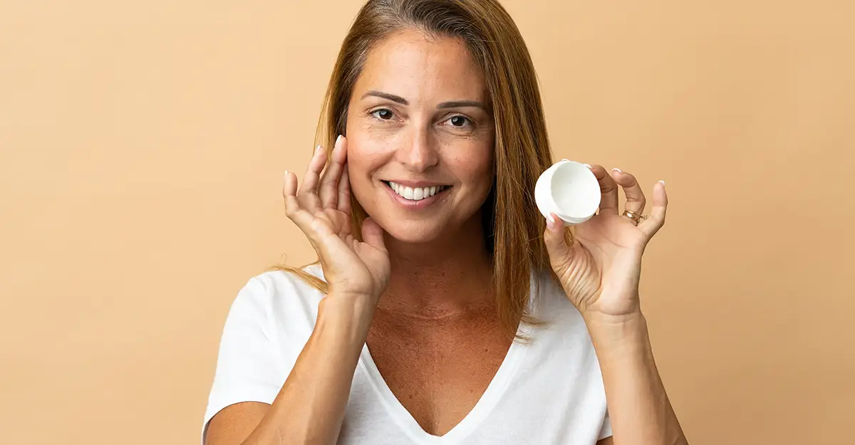 woman showing moisturizer