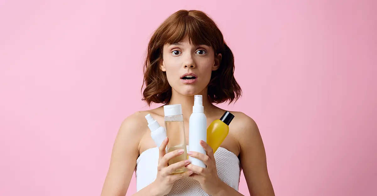Optimal product selection, woman holding skin care products
